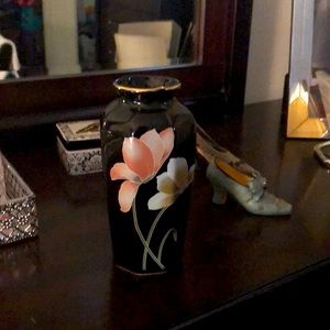 Small black floral gold trimmed vase.